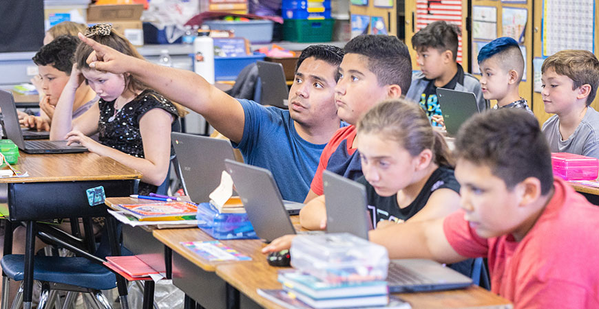 Fourth-graders at a Merced elementary school are introduced to agriculture-related sciences by undergrads in the FARMERS program.