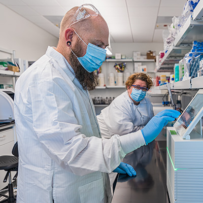 Professor Sistrom (left) and doctoral student Shari Larsen (right) in the lab. 